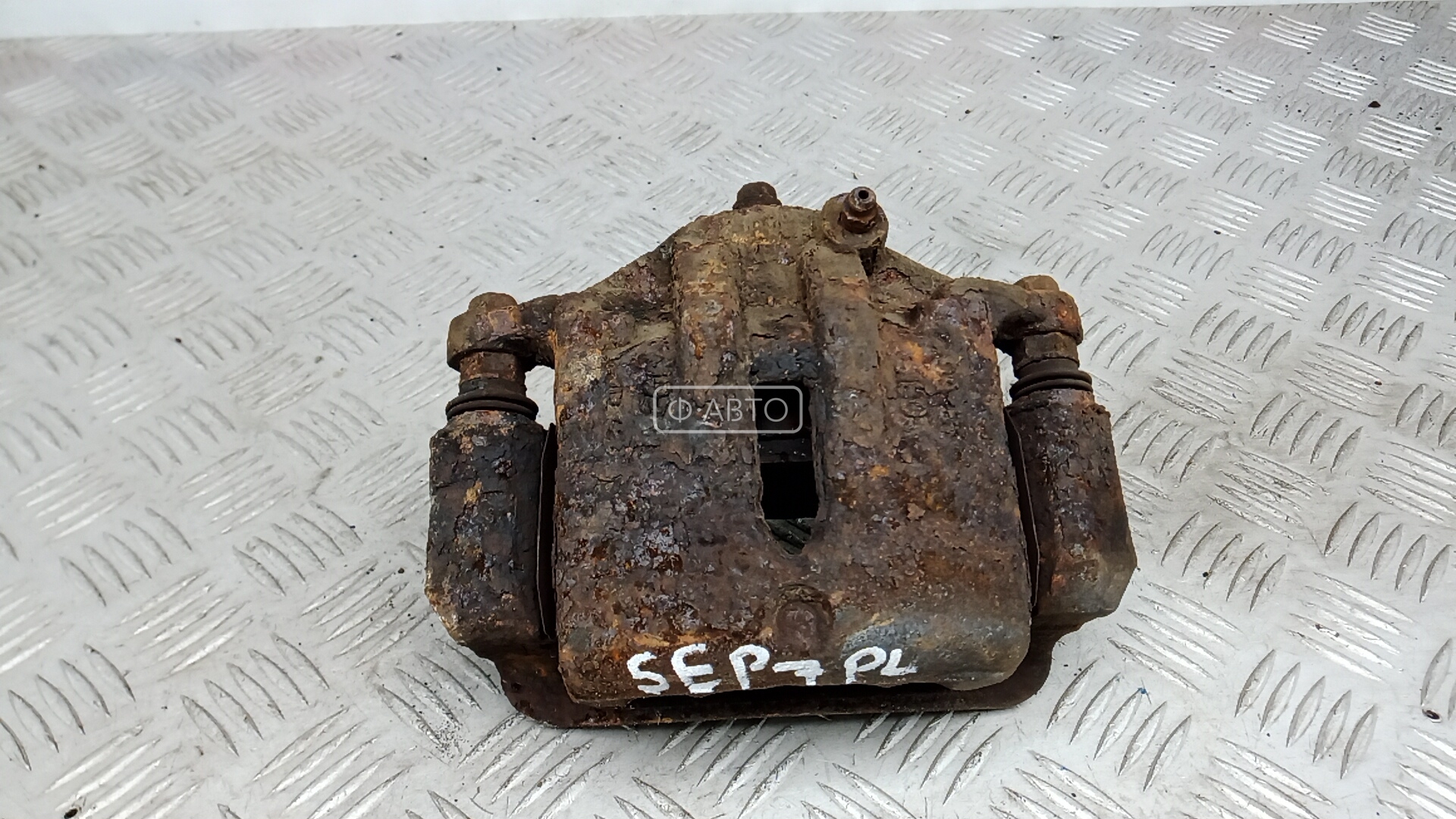 Суппорт тормозной передний левый