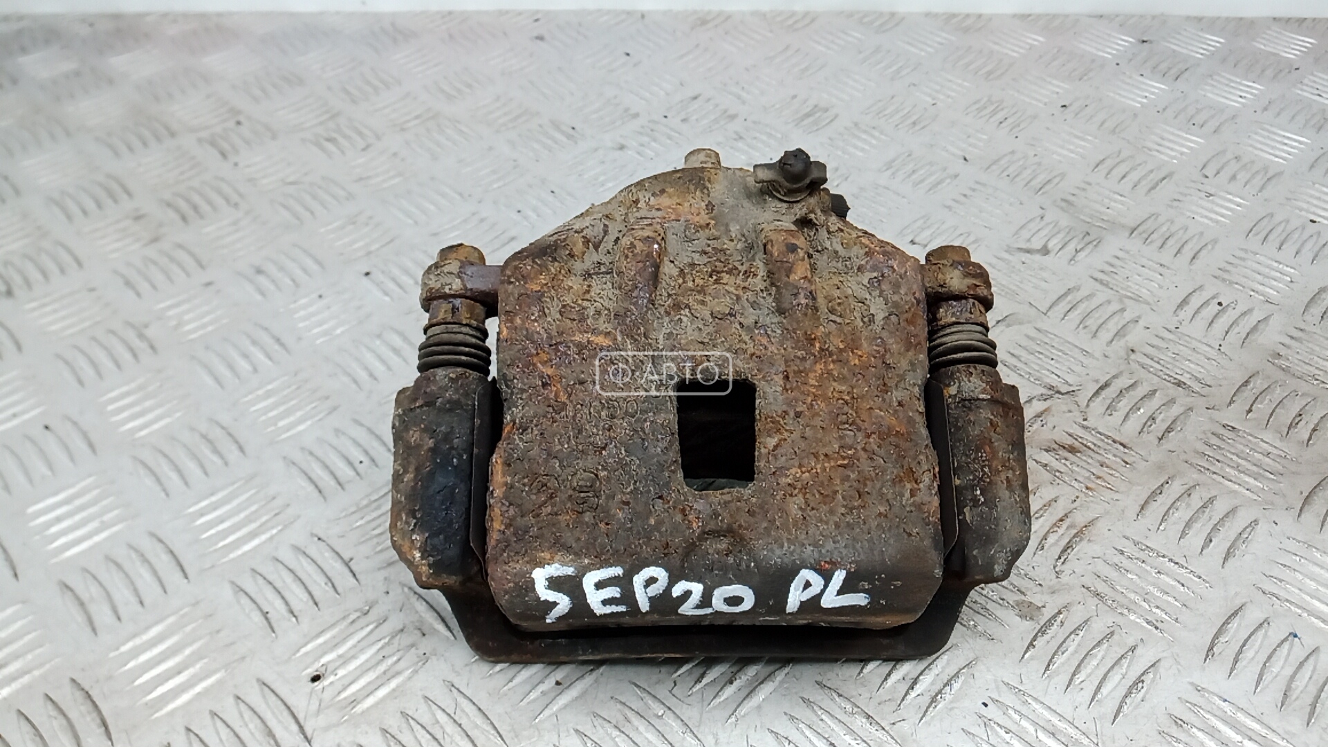 Суппорт тормозной передний левый