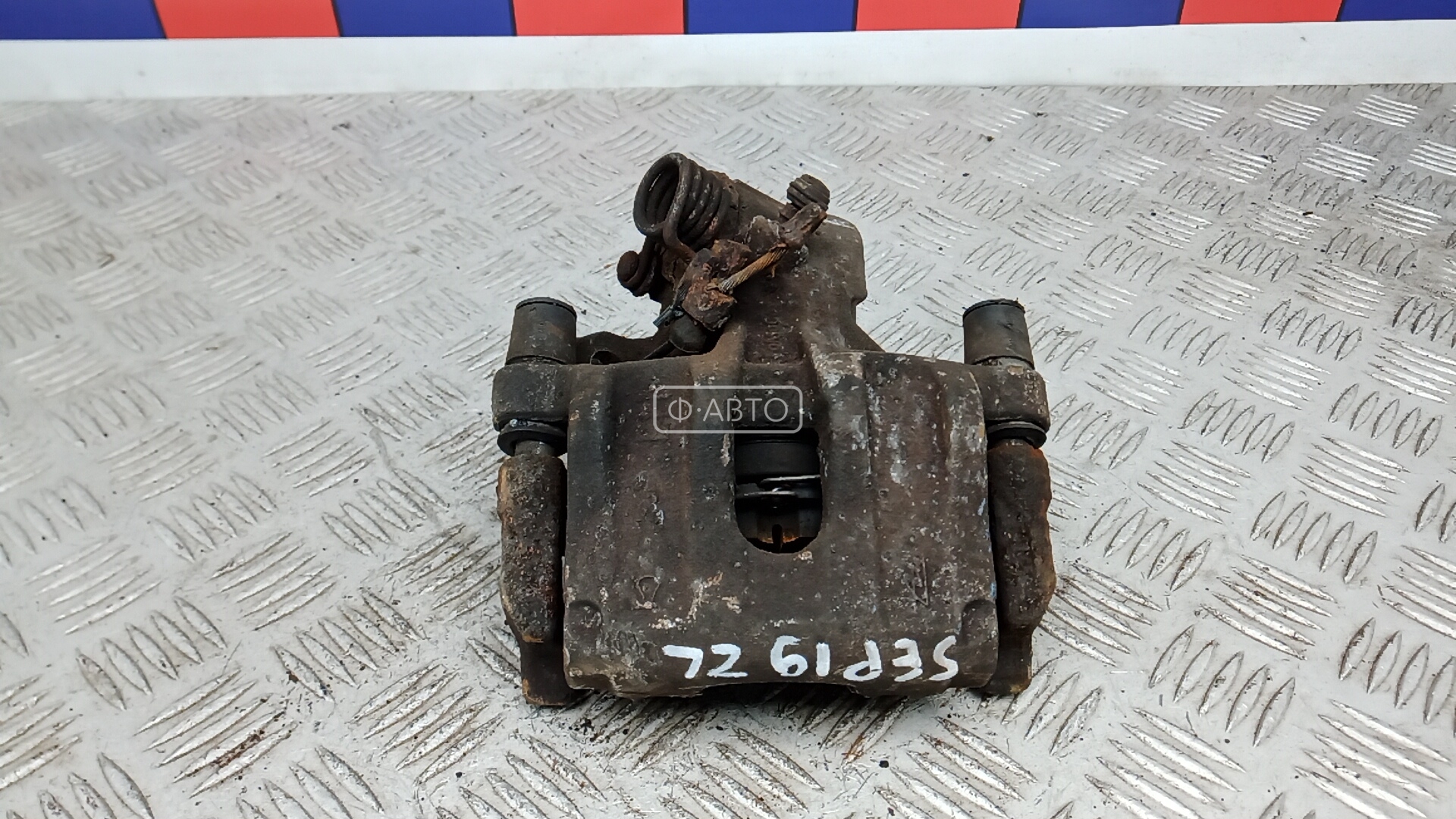 Суппорт тормозной задний левый