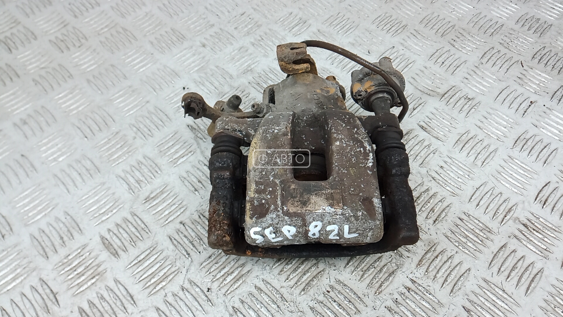 Суппорт тормозной задний левый