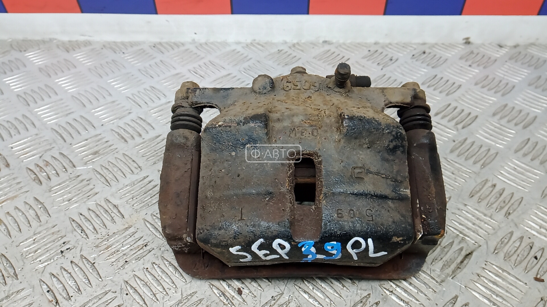 Суппорт тормозной передний левый