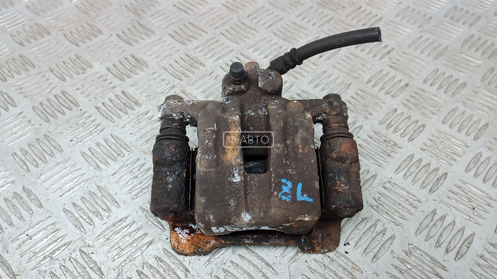 Суппорт тормозной задний левый