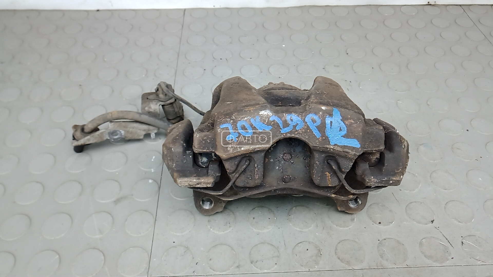 Суппорт тормозной передний левый