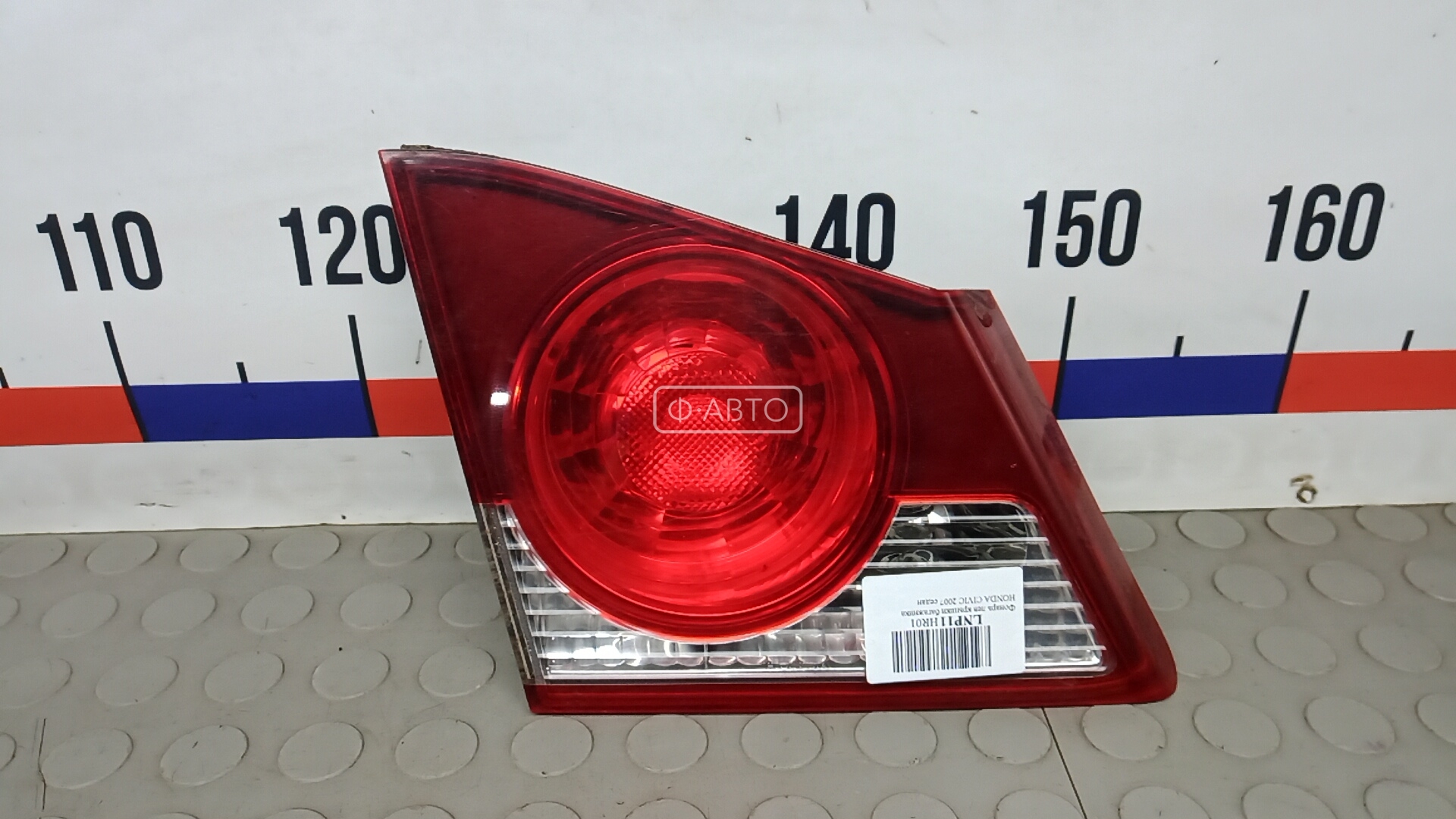 Фонарь левый крышки багажника