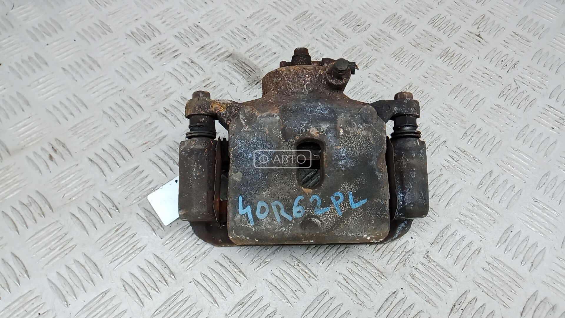 Суппорт тормозной передний левый