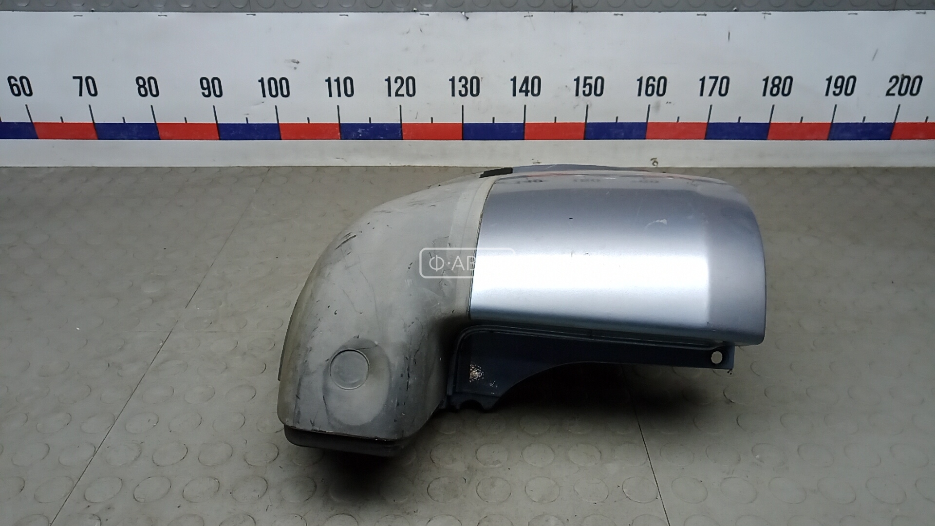 Клык бампера задний левый