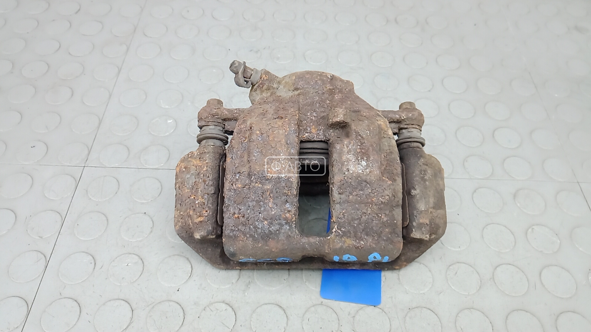 Суппорт тормозной передний левый