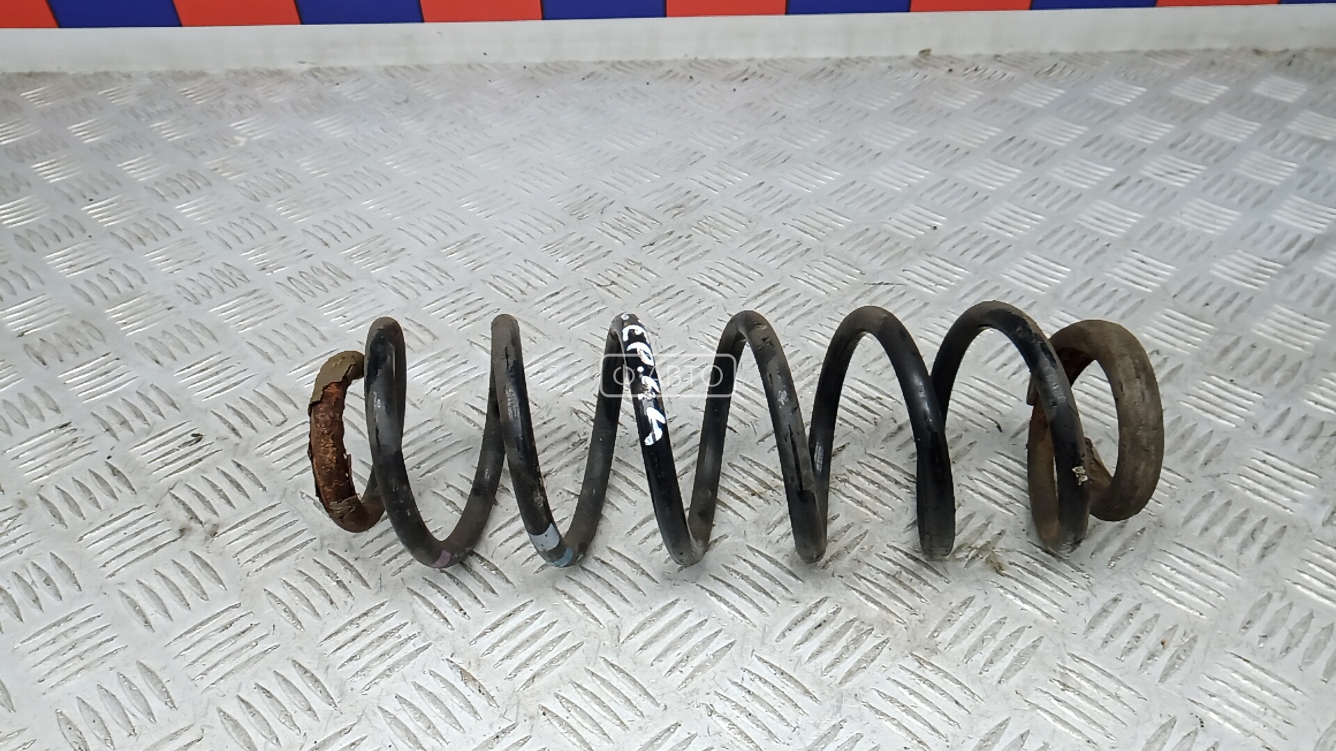 Пружина задняя