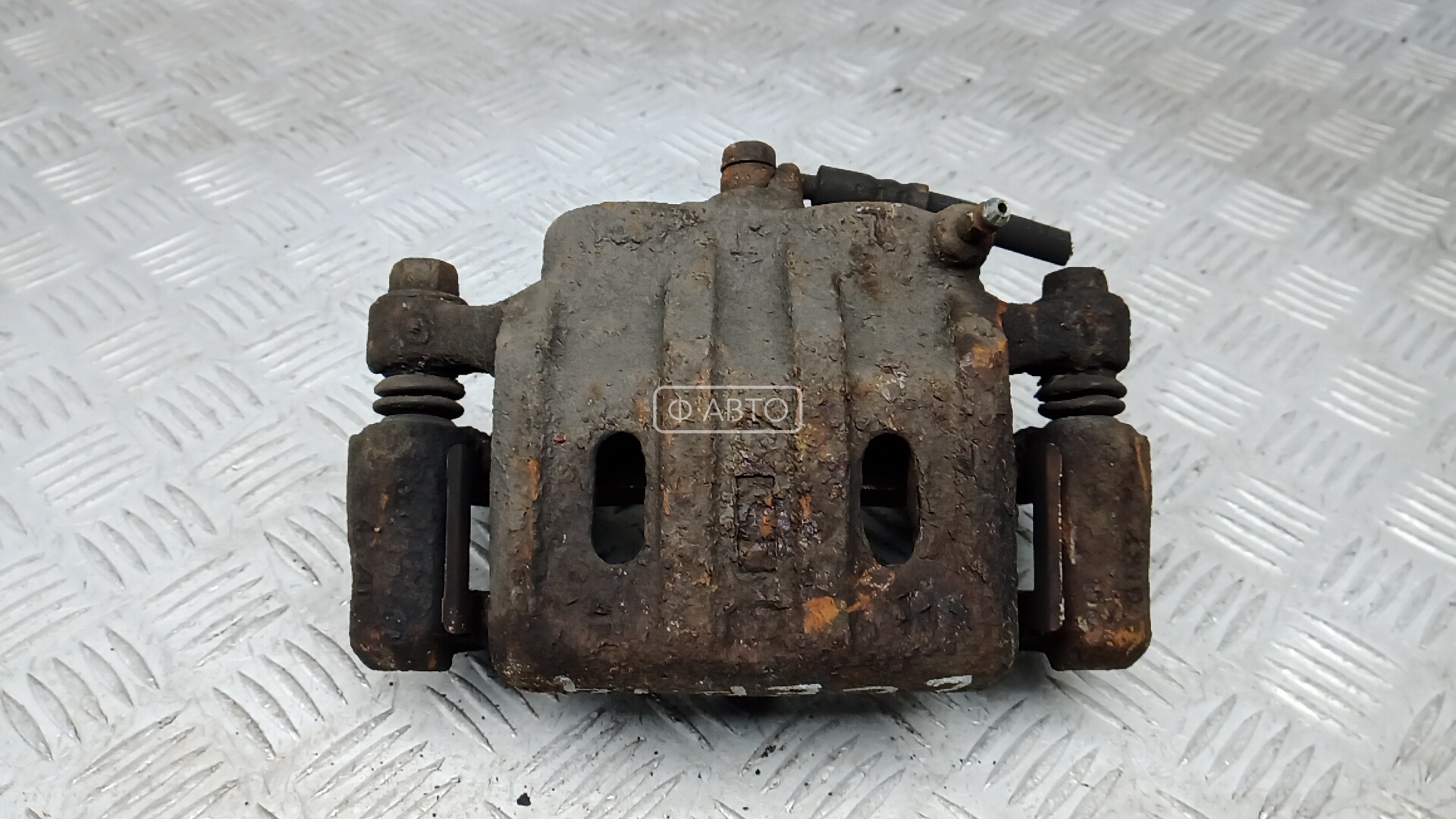 Суппорт тормозной передний левый