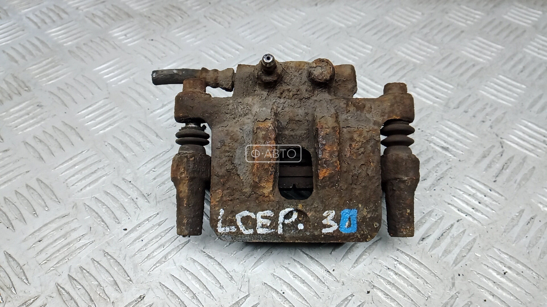 Суппорт тормозной задний левый