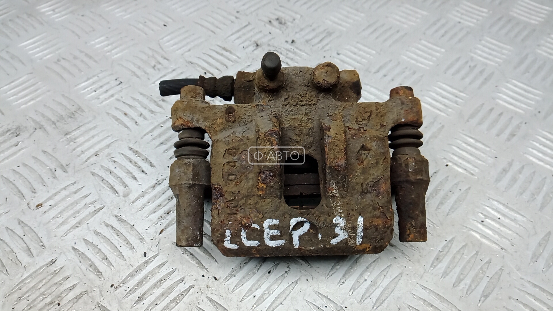 Суппорт тормозной задний левый