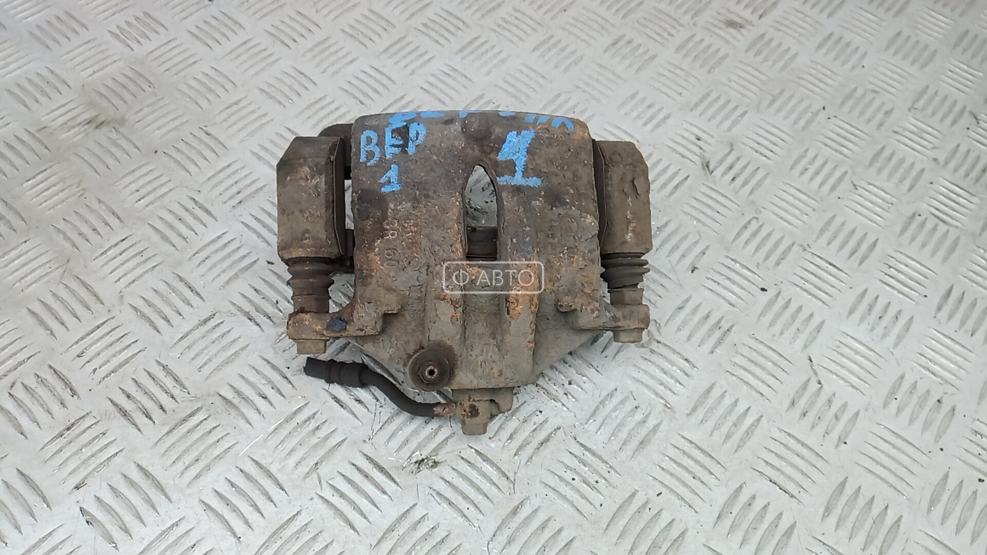 Суппорт тормозной передний левый