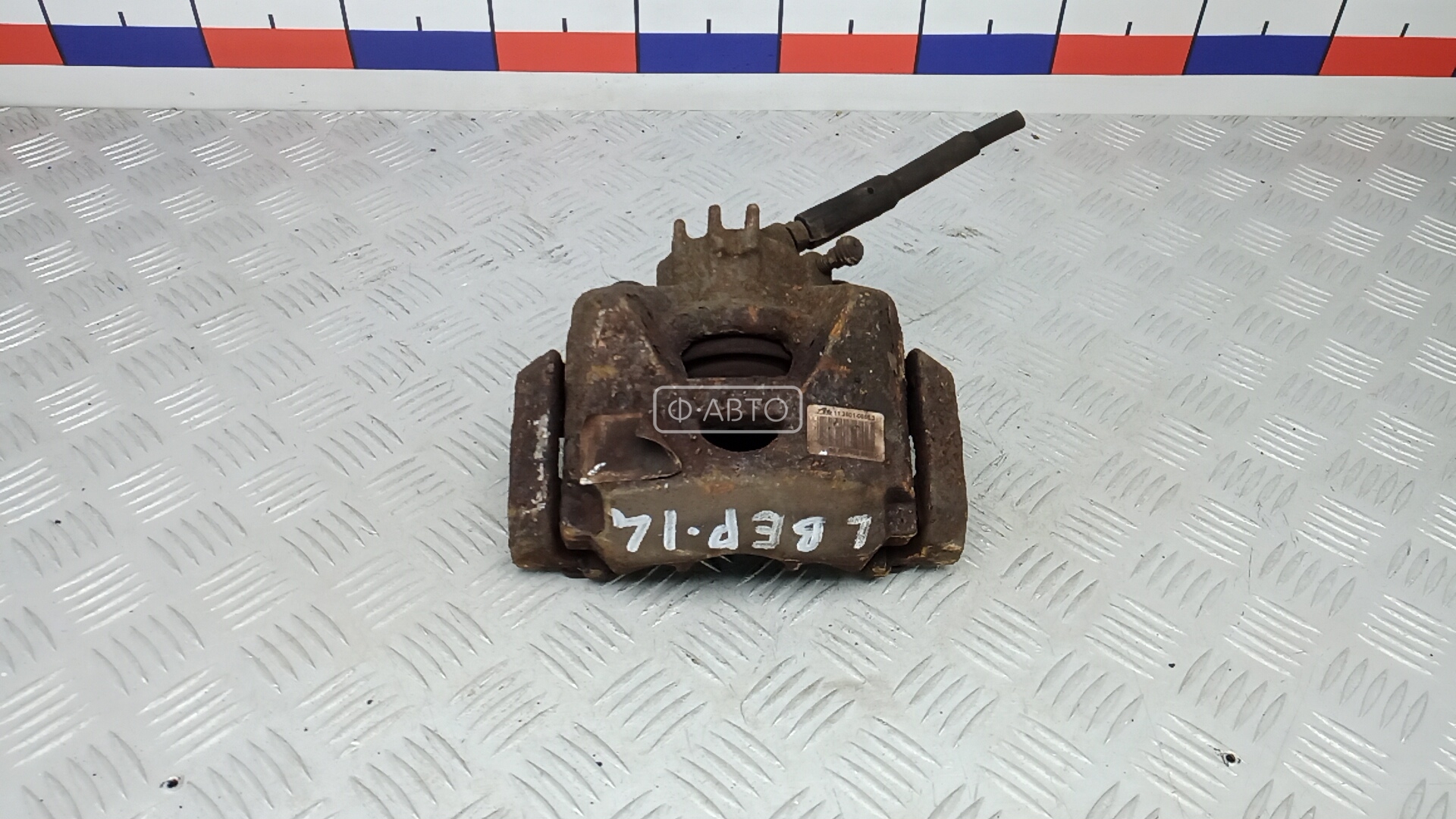 Суппорт тормозной передний левый