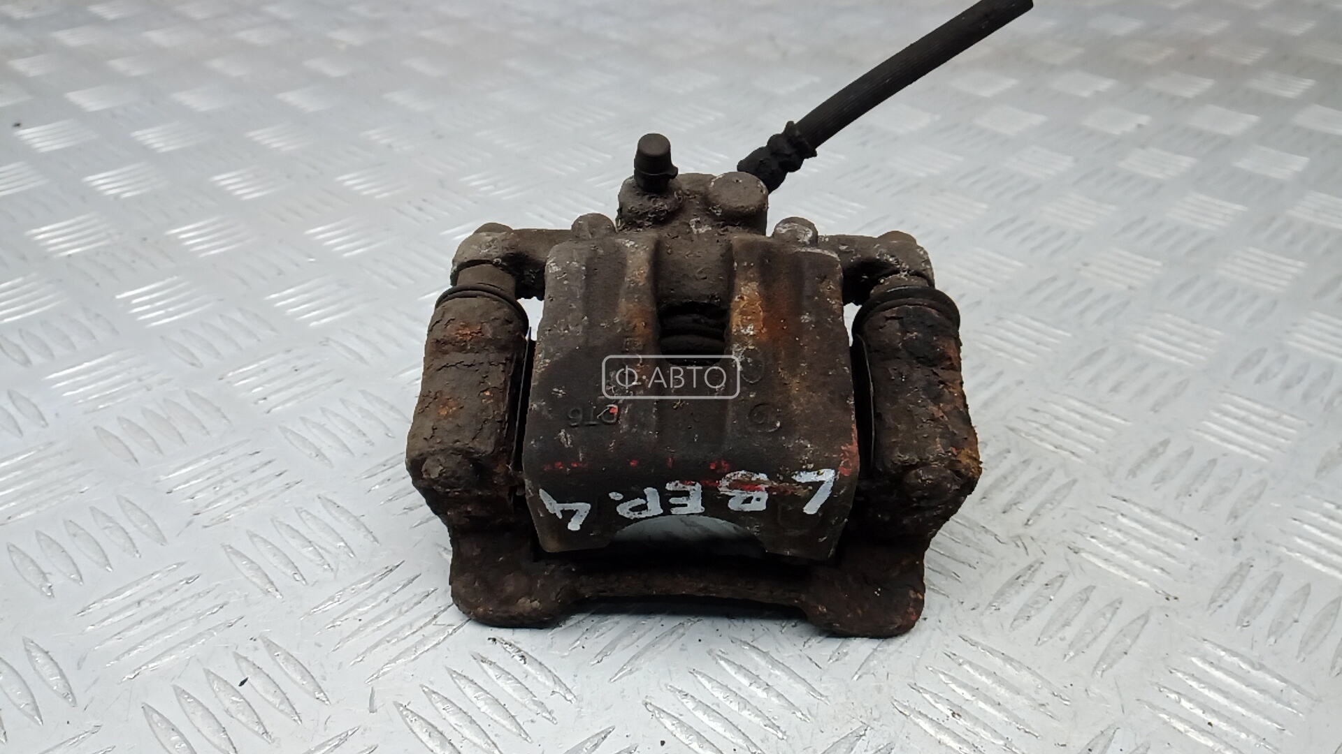 Суппорт тормозной задний левый