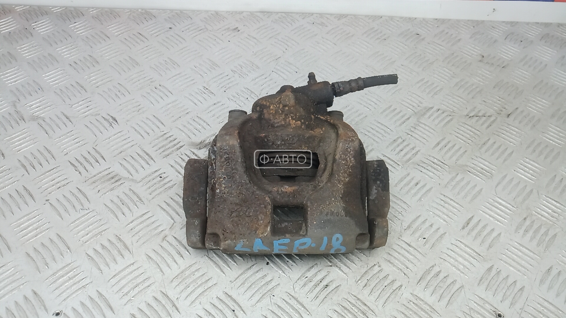 Суппорт тормозной передний левый