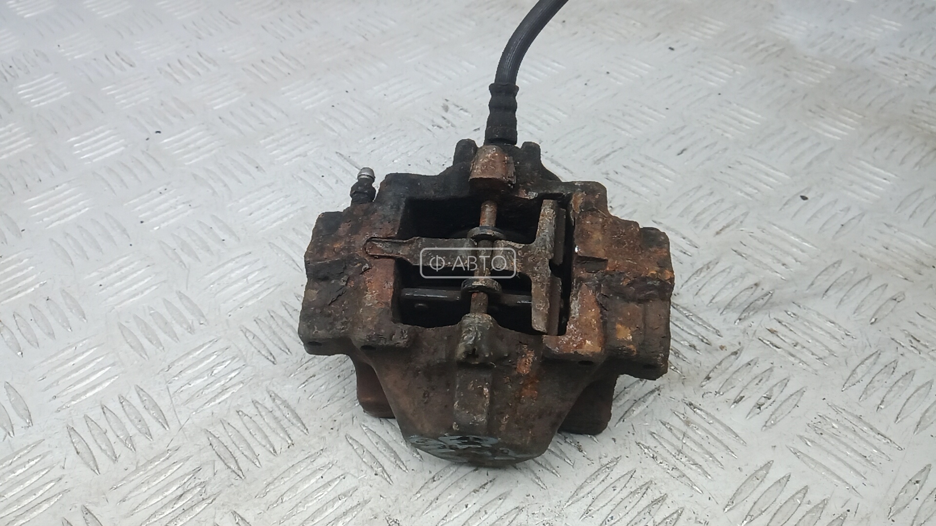 Суппорт тормозной задний левый