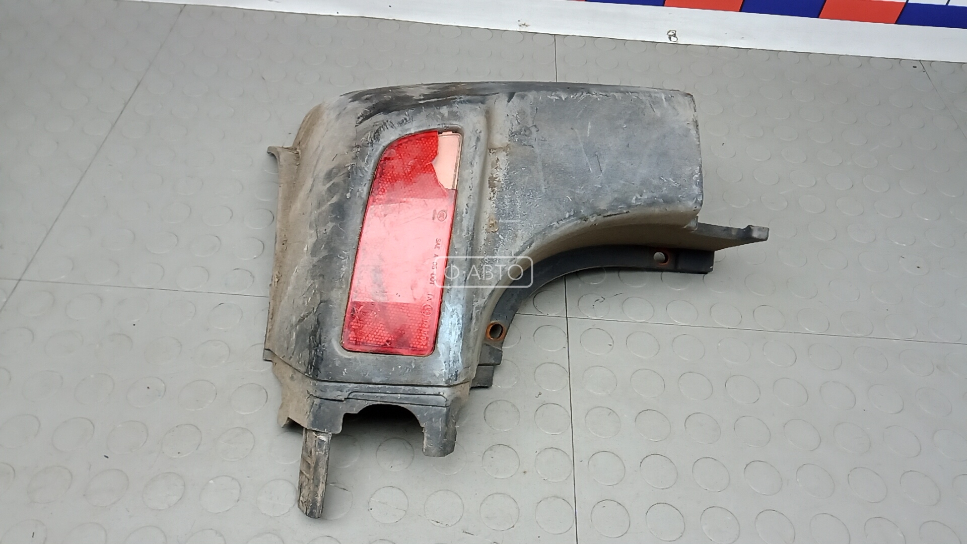 Клык бампера задний левый