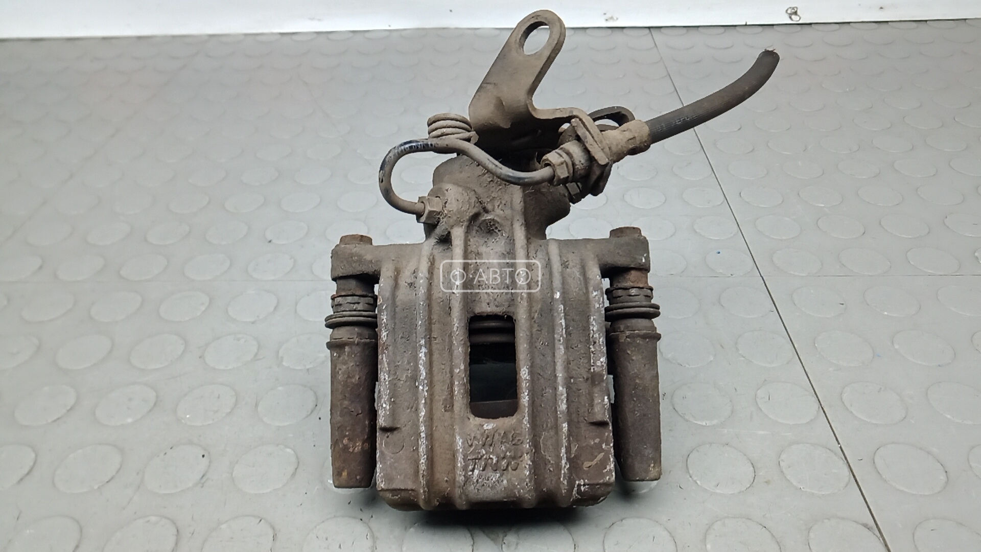 Суппорт тормозной задний левый