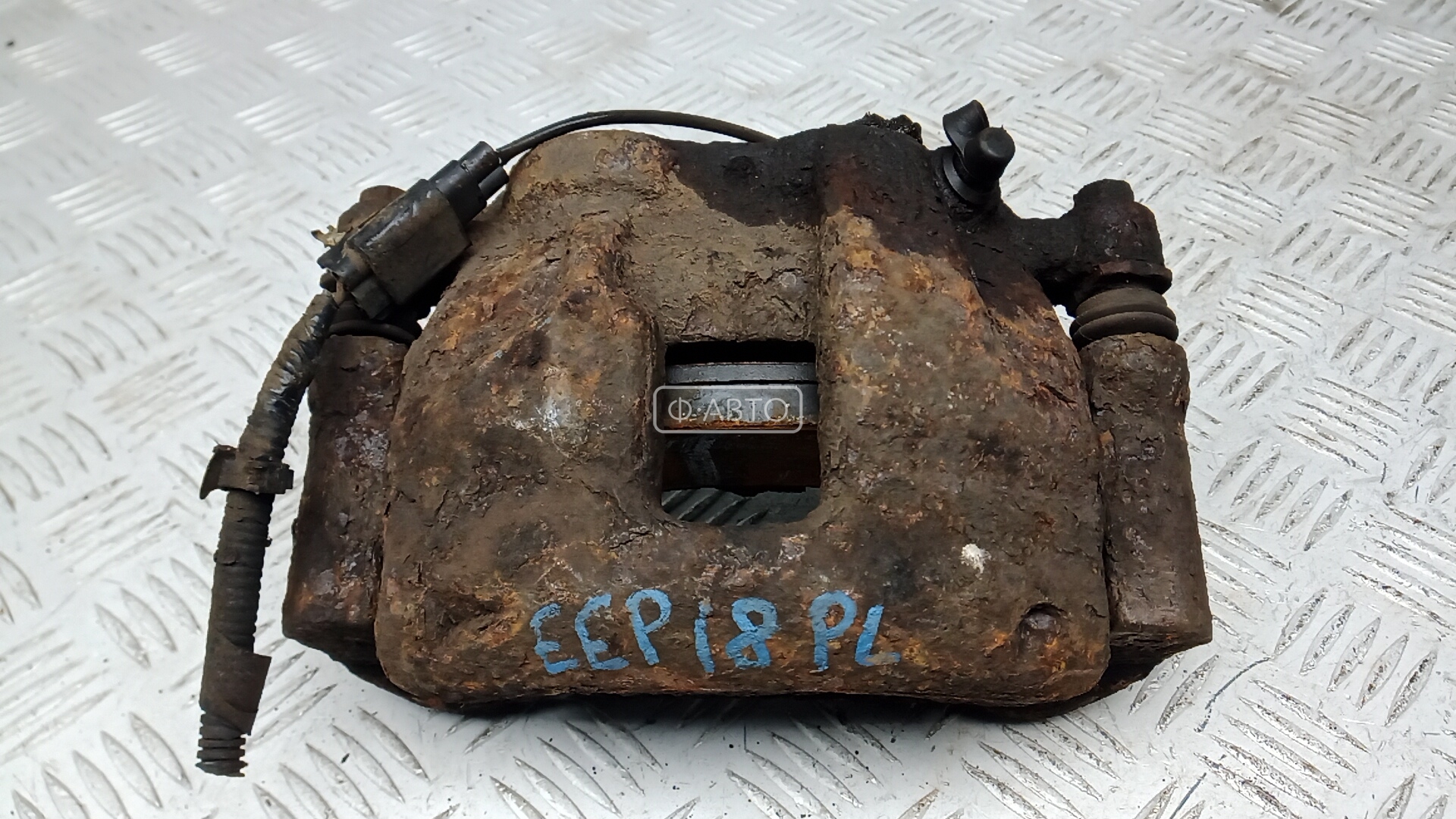 Суппорт тормозной передний левый