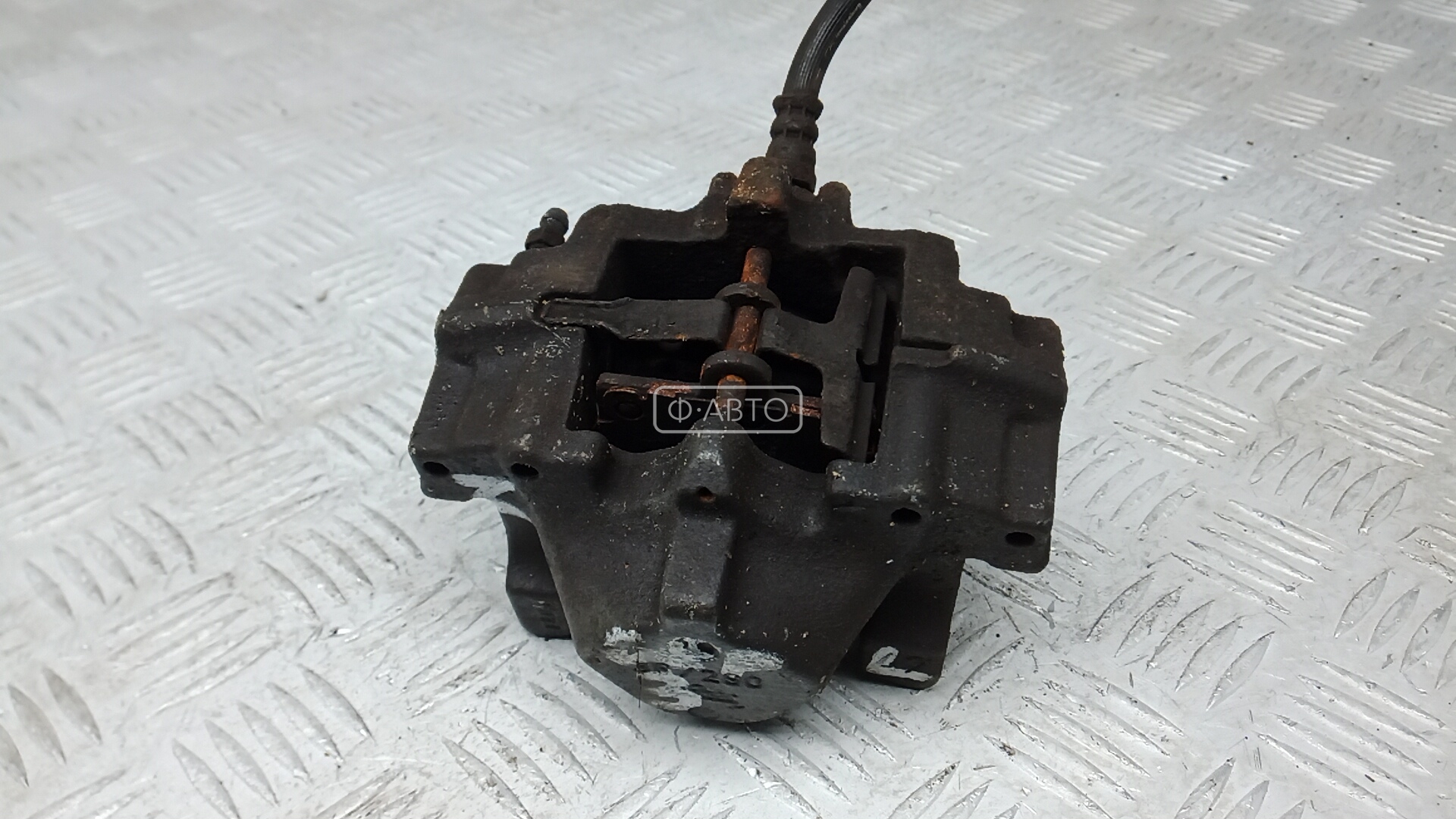 Суппорт тормозной задний левый