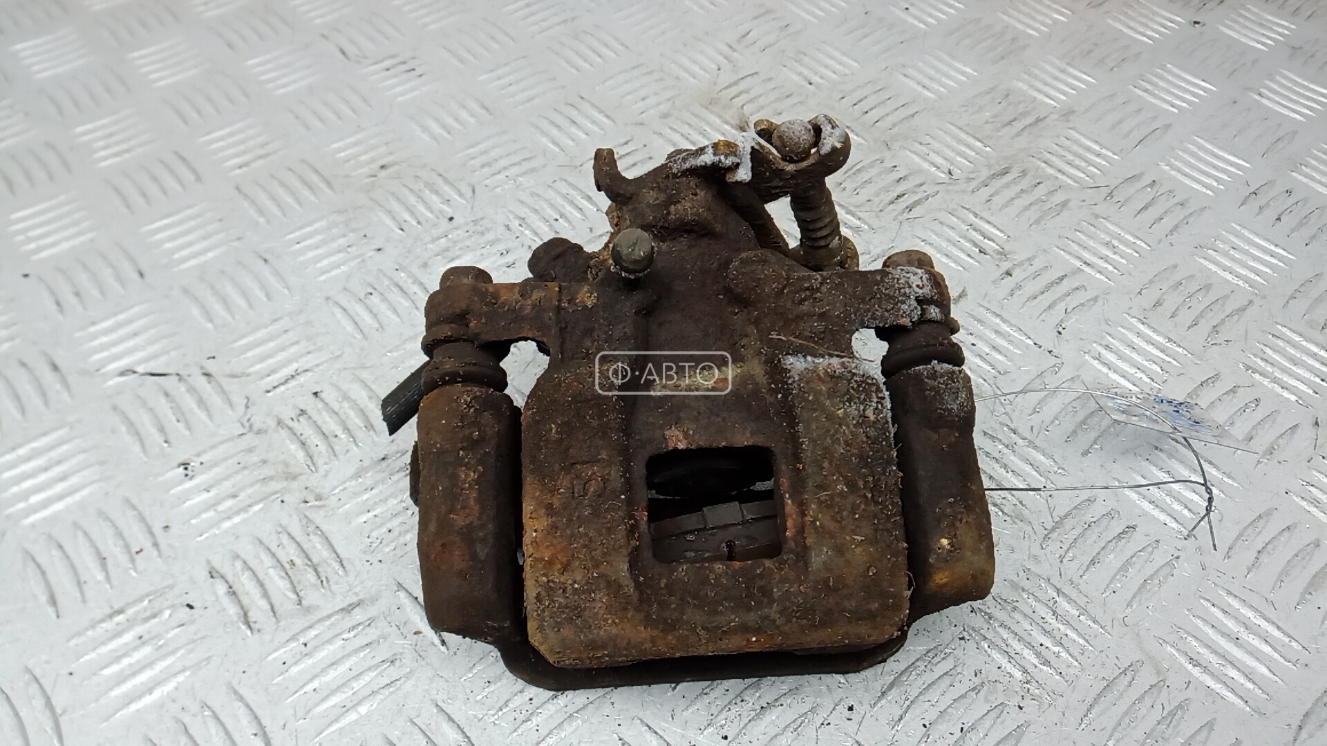Суппорт тормозной задний левый