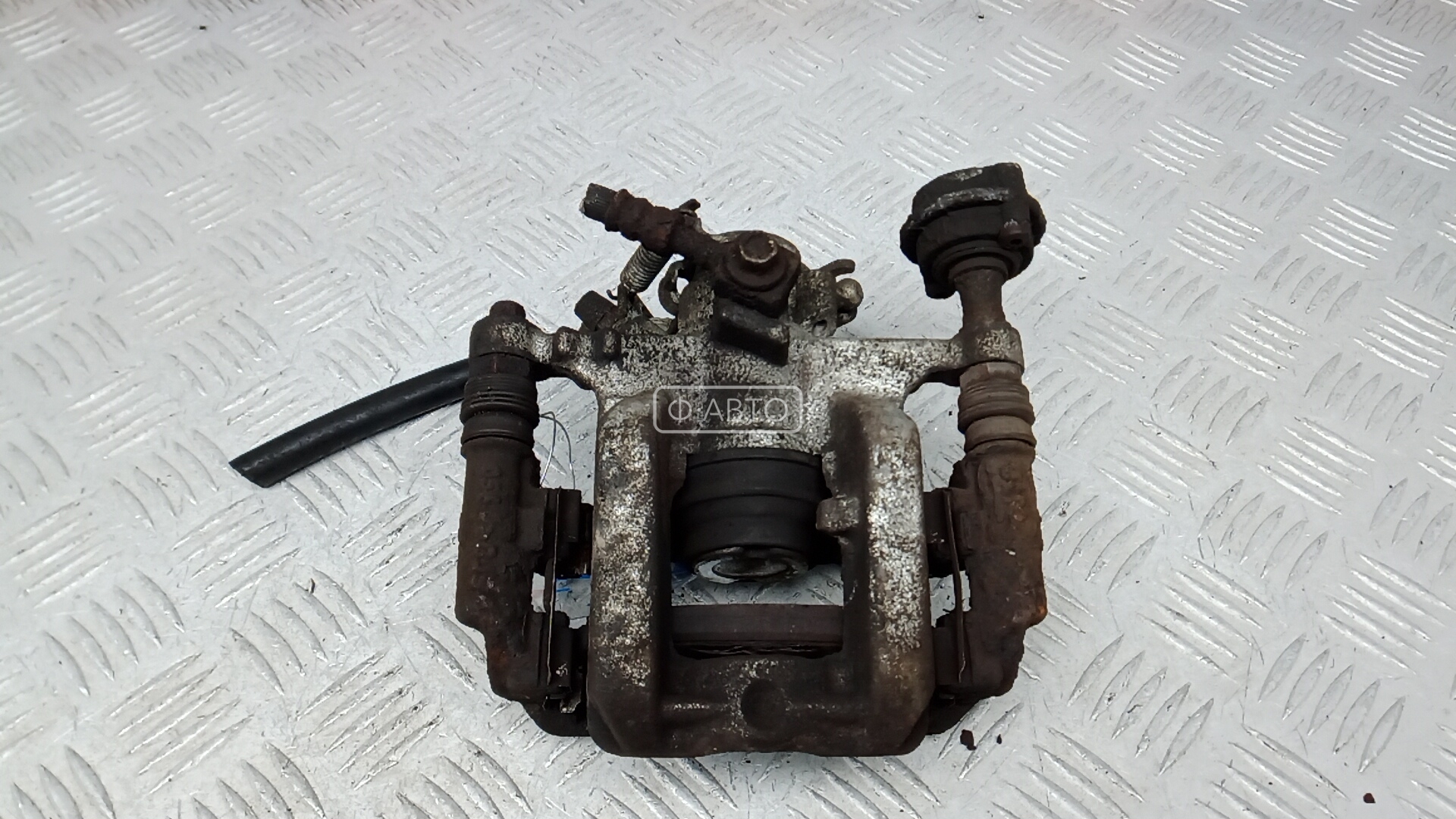 Суппорт тормозной задний левый