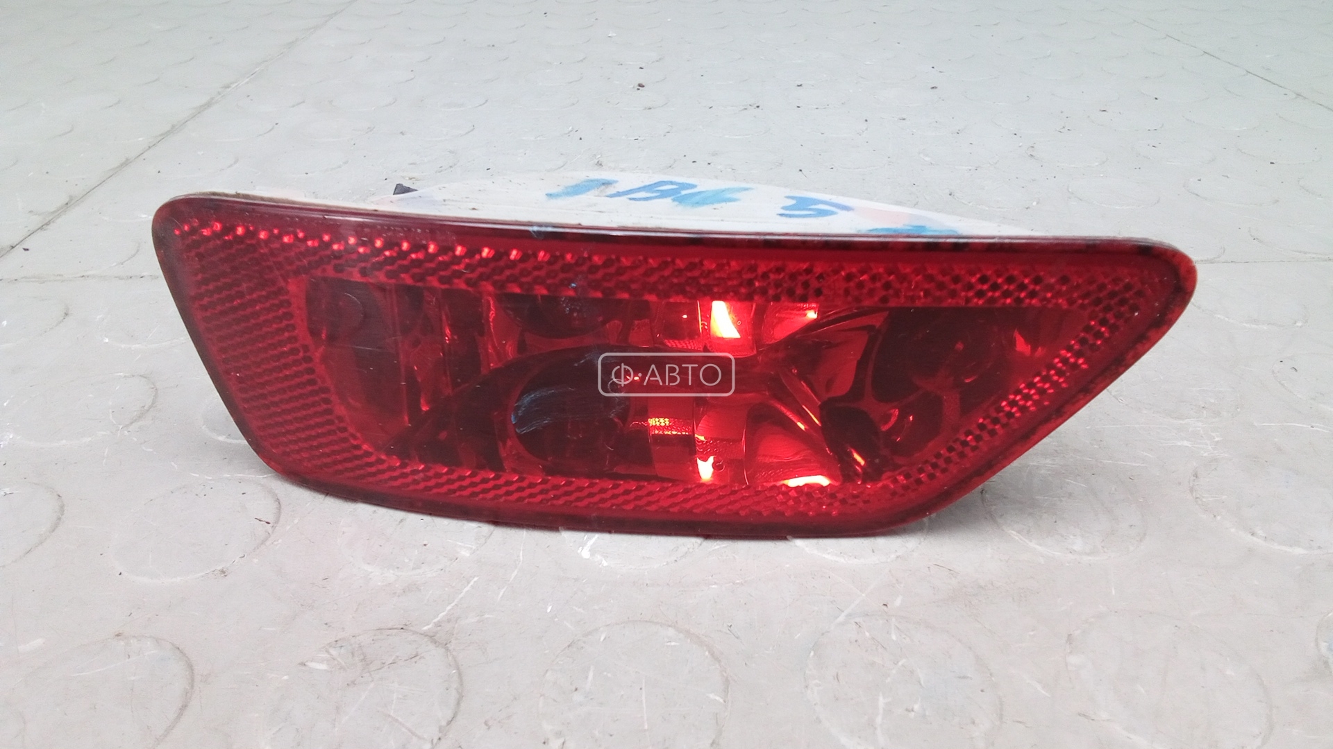 Фонарь бампера задний левый