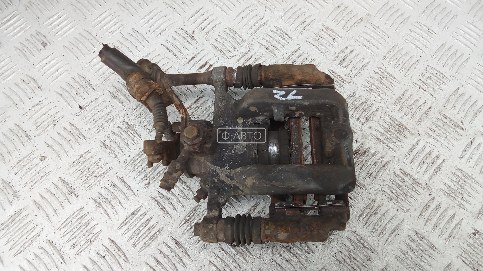 Суппорт тормозной задний левый