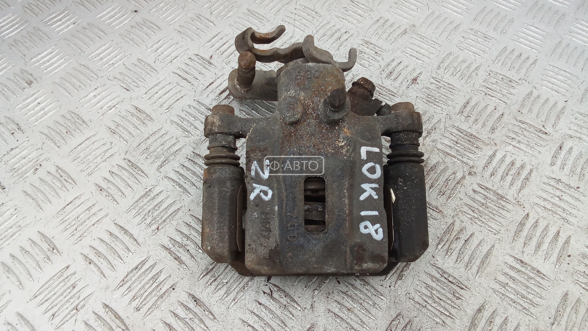 Суппорт тормозной задний правый