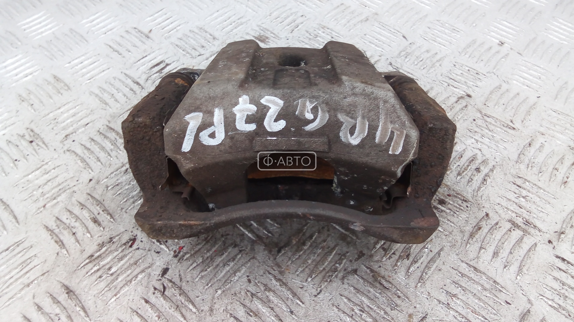 Суппорт тормозной передний левый