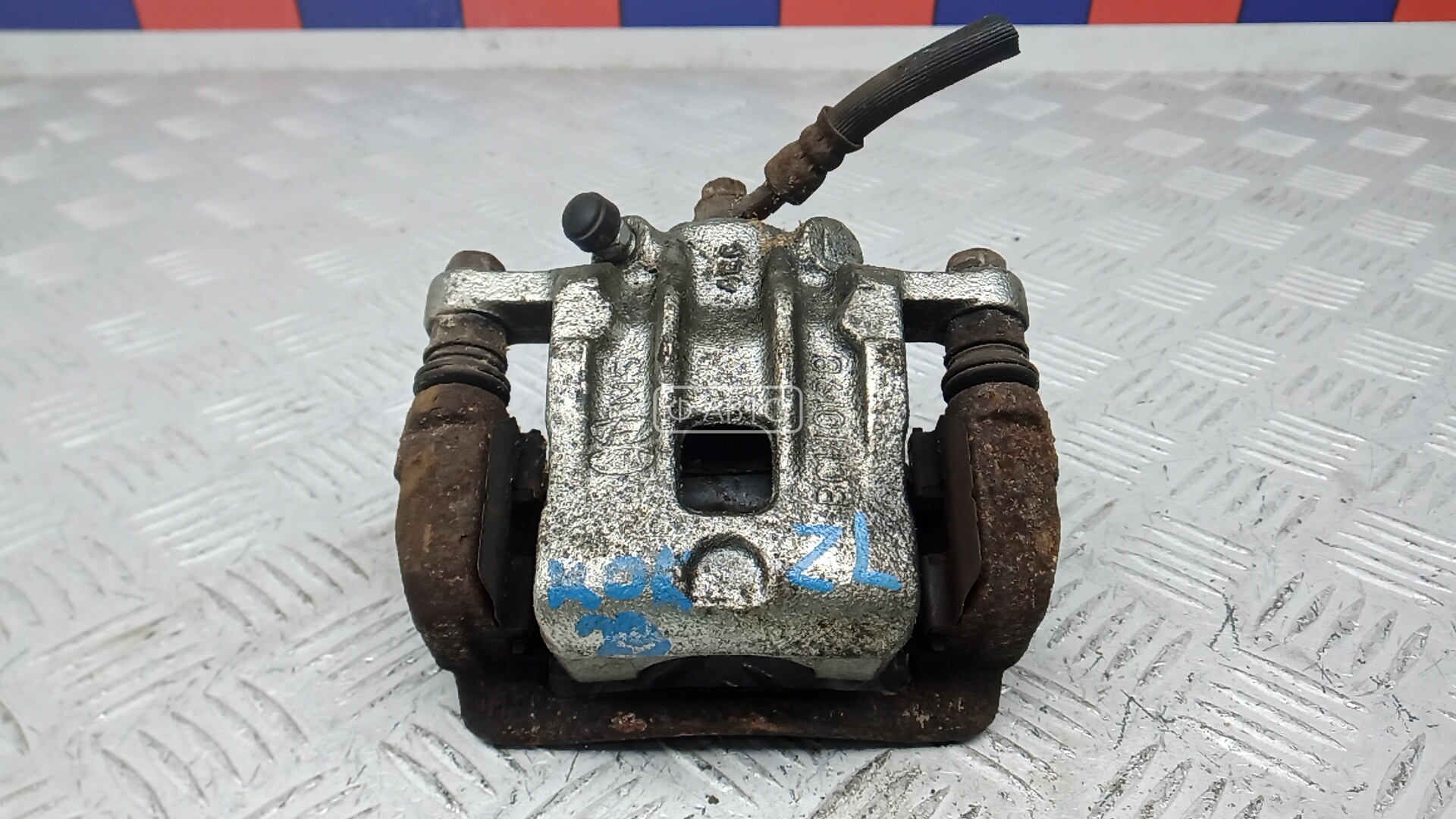 Суппорт тормозной задний левый