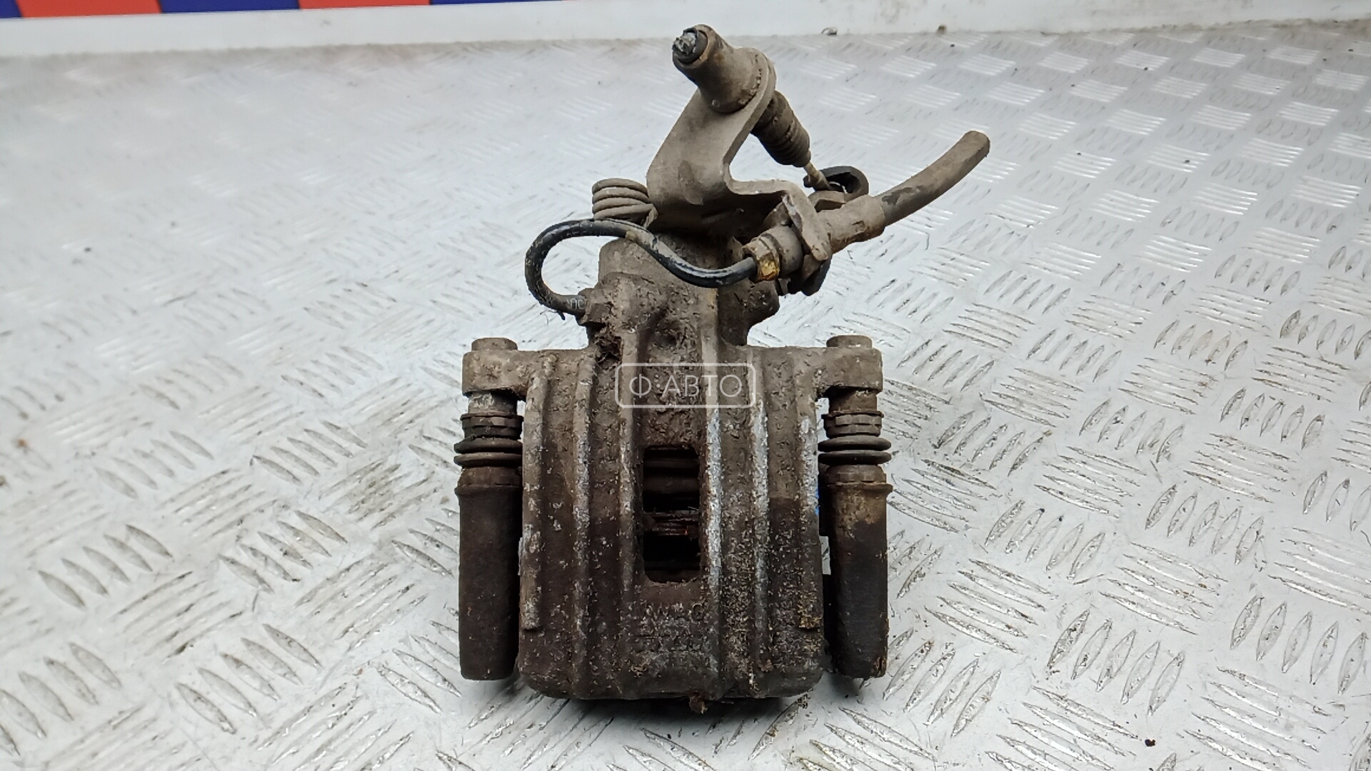 Суппорт тормозной задний левый