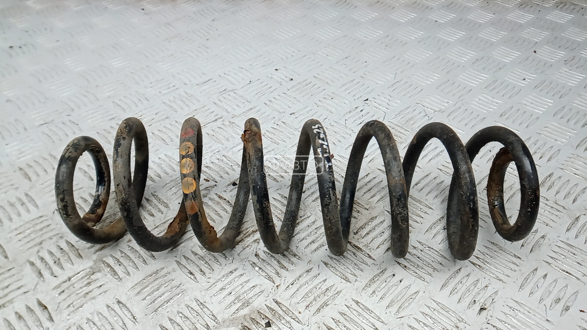 Пружина задняя