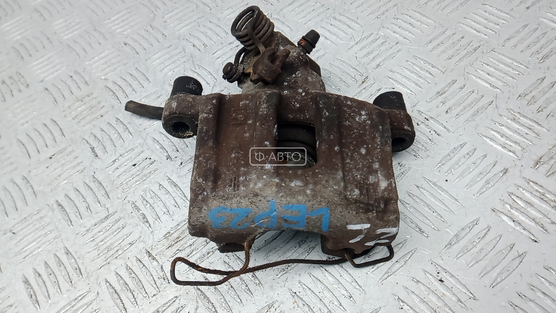 Суппорт тормозной задний левый