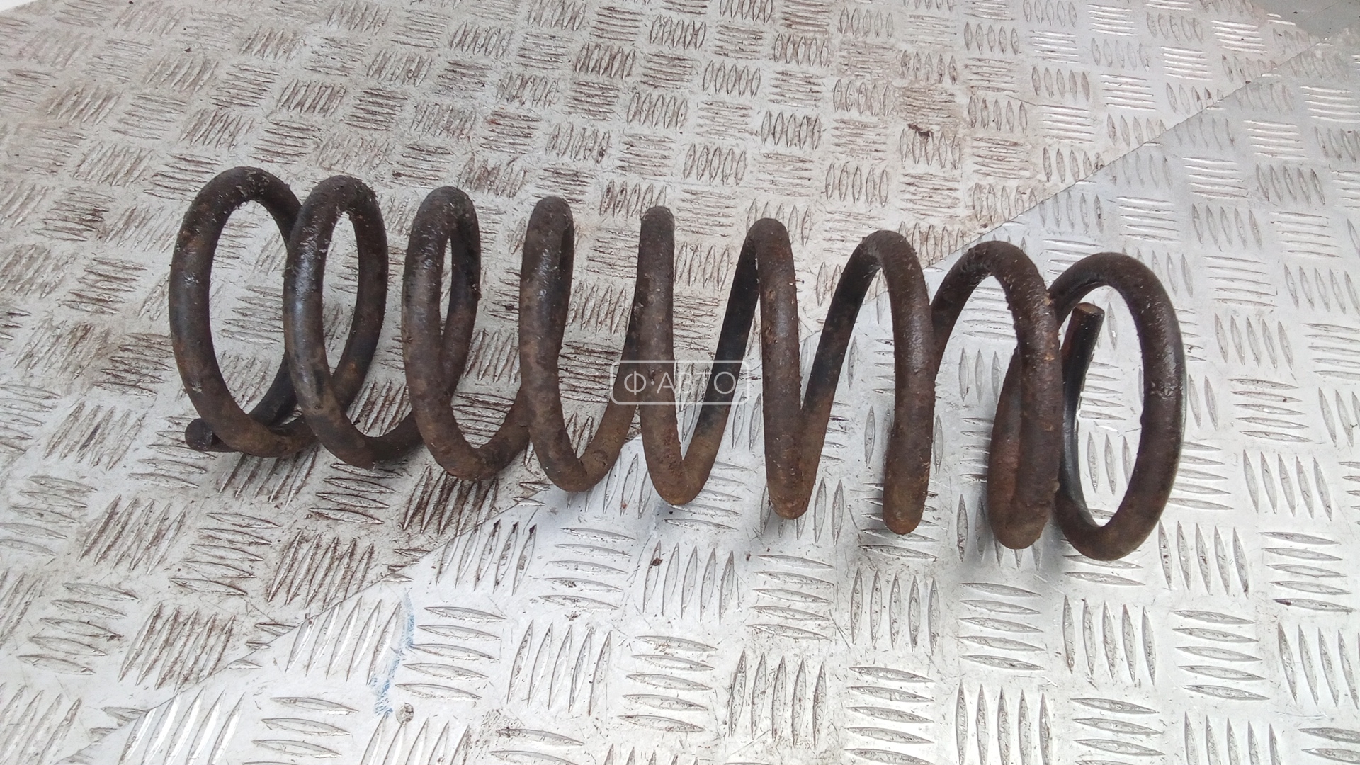 Пружина задняя