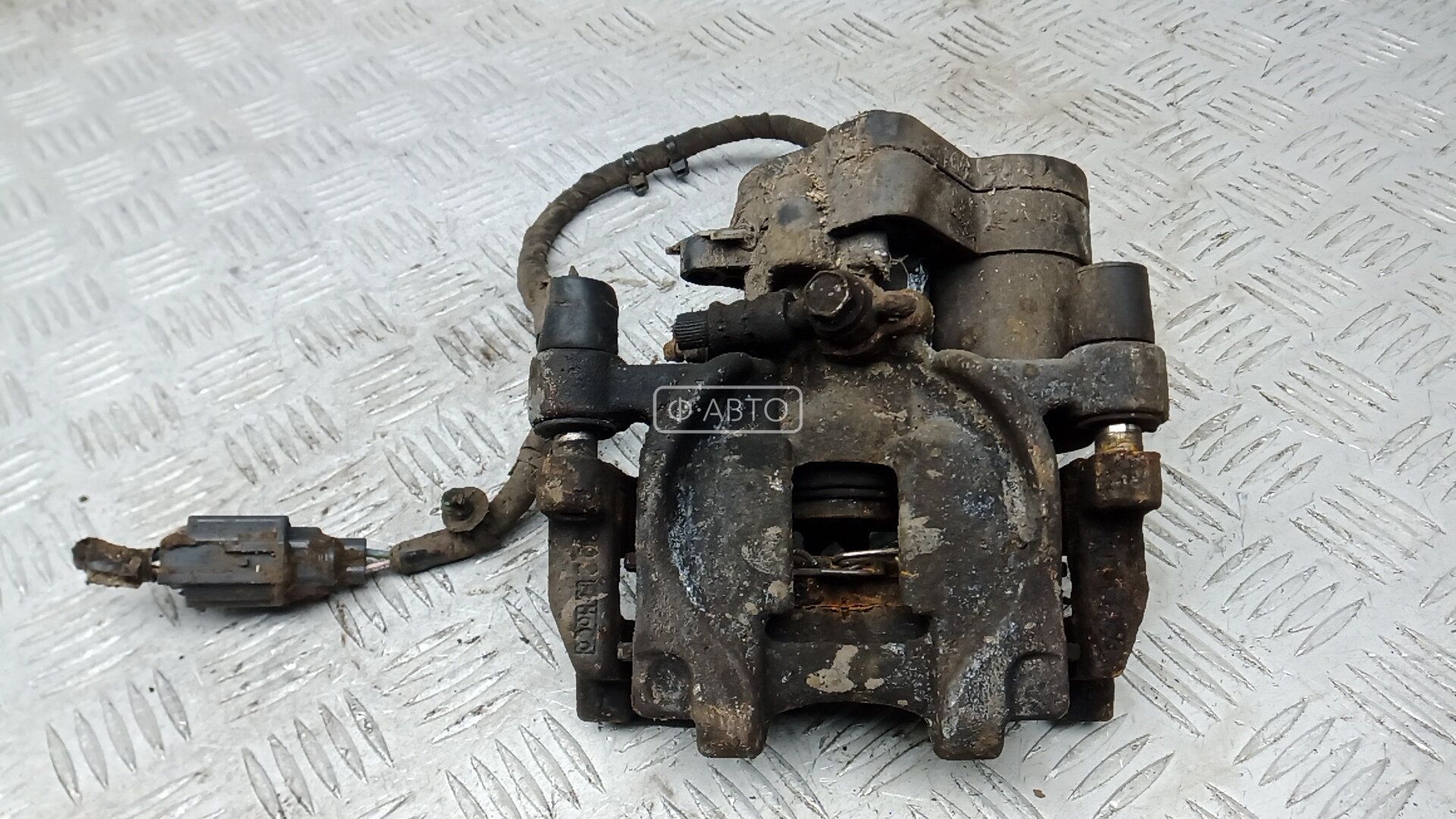 Суппорт тормозной задний левый